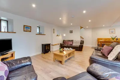 a living room with two couches and a tv at 3 Bed in Padstow oc-p00281 in St Merryn