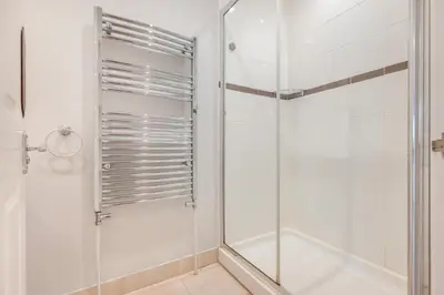 a shower with a glass door in a bathroom at 3 Bed in Padstow oc-p00329 in Padstow