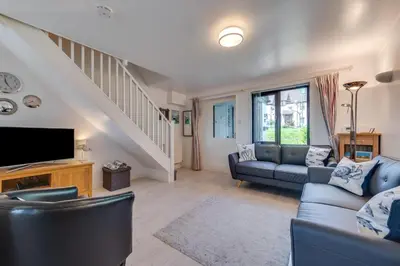a living room with a couch and a tv at 2 Bed in Padstow oc-p00330 in Padstow