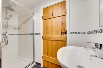 a bathroom with a sink and a shower at 2 Bed in Padstow oc-p00282 in St Merryn
