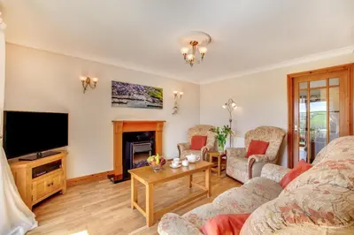 a living room with a couch and a television at 2 Bed in Newquay oc-p00335 in Mawgan Porth