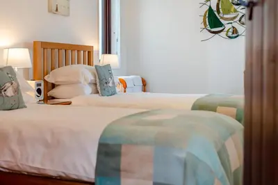 two beds in a hotel room with two beds at 2 Bed in Padstow oc-p00385 in Padstow