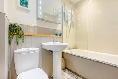 a bathroom with a toilet and a sink and a bath tub at 2 Bed in Padstow oc-p00385 in Padstow