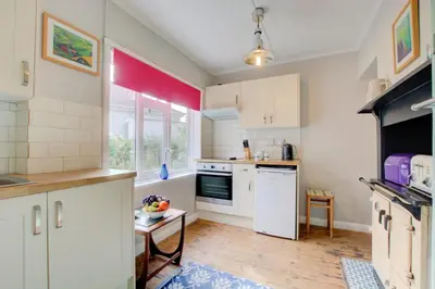 a kitchen with white appliances and a window at 2 Bed in Newquay oc-p00359 in Mawgan Porth