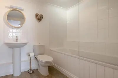 a bathroom with a toilet and a sink and a tub at 3 Bed in Padstow oc-p00397 in Padstow