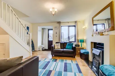 a living room with a couch and a fireplace at 2 Bed in Padstow oc-p00390 in Padstow