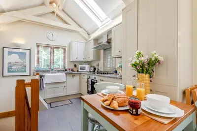 a kitchen with a table with a plate of food on it at 2 Bed in Bodmin oc-p00405 in Bodmin