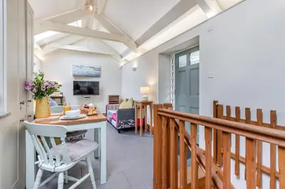 a dining room and living room with a table at 2 Bed in Bodmin oc-p00405 in Bodmin