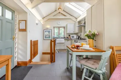 a kitchen and dining room with a table and chairs at 2 Bed in Bodmin oc-p00405 in Bodmin
