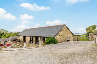 an image of a stone house with a driveway at 3 Bed in Wadebridge oc-p00421 in Saint Issey