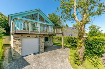a house with a garage and a balcony at 3 Bed in Wadebridge oc-p00427 in Little Petherick
