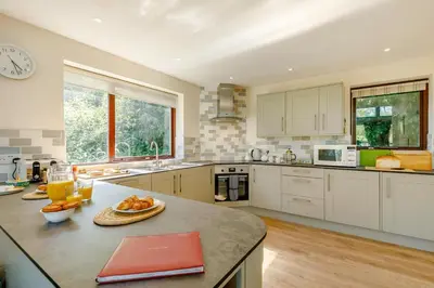 a kitchen with a counter with a bowl of fruit on it at 3 Bed in Wadebridge oc-p00427 in Little Petherick