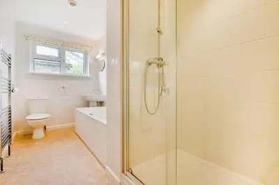 a bathroom with a shower and a toilet and a sink at 4 Bed in Padstow oc-p00401 in Padstow