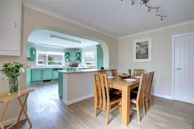 a kitchen and dining room with a table and chairs at 2 Bed in Padstow oc-p00464 in St Merryn