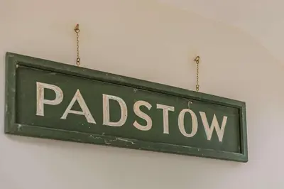 a green street sign hanging on a wall at 3 Bed in Padstow oc-p00418 in Padstow