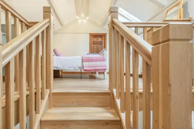 a staircase in a house with a bed in the background at 1 Bed in Bodmin oc-p00438 in Bodmin