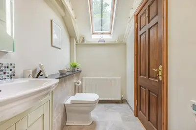 a bathroom with a toilet and a sink and a window at 1 Bed in Bodmin oc-p00438 in Bodmin