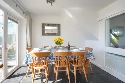 a dining room with a table and chairs at 4 Bed in Padstow oc-p00425 in St Merryn