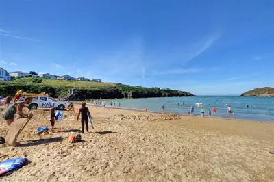 a group of people on a beach near the water at 3 Bed in Newquay oc-p00484 in Newquay