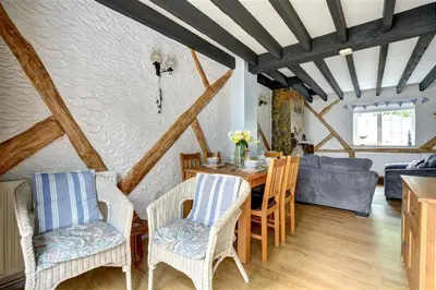 a living room with a table and chairs and a couch at 3 Bed in Newquay oc-p00484 in Newquay