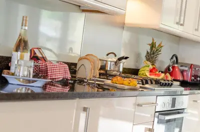 a kitchen with a counter top with food on it at 3 Bed in Wadebridge oc-p00415 in Saint Issey