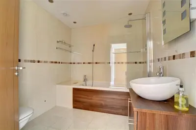 a bathroom with a sink and a tub and a toilet at 3 Bed in Wadebridge oc-p00415 in Saint Issey