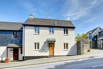 a white house on the side of a street at 2 Bed in Padstow oc-p00481 in Padstow