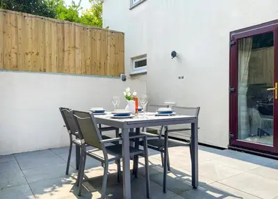 a black table and chairs on a patio at 2 Bed in Padstow oc-p00481 in Padstow