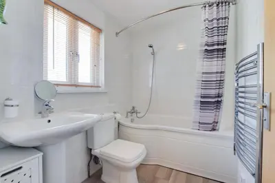 a bathroom with a sink and a toilet and a tub at 2 Bed in Padstow oc-p00481 in Padstow