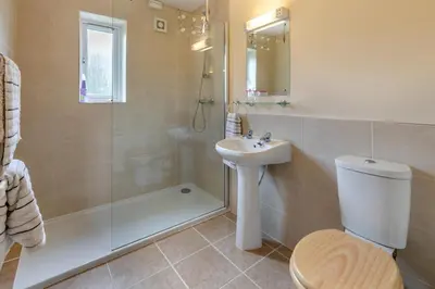 a bathroom with a toilet and a sink and a shower at 2 Bed in Padstow oc-p00486 in St Merryn