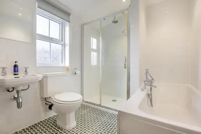 a bathroom with a toilet and a sink and a shower at 3 Bed in Padstow oc-p00455 in Padstow
