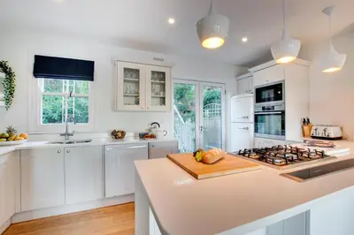 a kitchen with white cabinets and a counter top at 3 Bed in St Ives oc-p00495 in St Ives