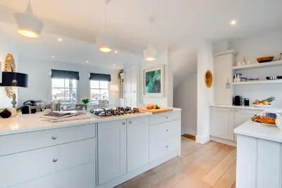 a kitchen with white cabinets and a white counter top at 3 Bed in St Ives oc-p00495 in St Ives