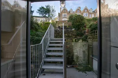 a staircase leading to a house from a glass door at 3 Bed in St Ives oc-p00495 in St Ives