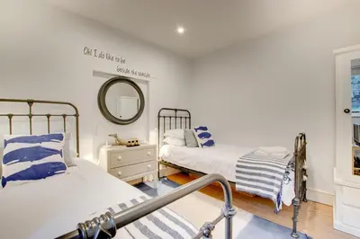 a bedroom with two beds and a mirror at 3 Bed in St Ives oc-p00495 in St Ives