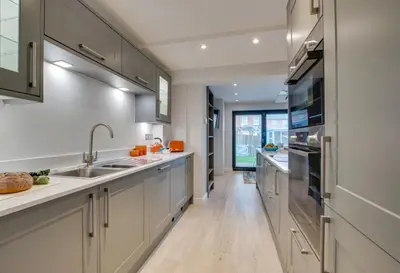 a kitchen with white cabinets and a sink at 3 Bed in Padstow oc-p00504 in Padstow