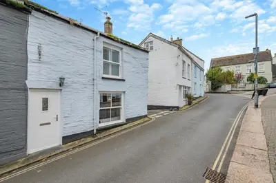 a street with white houses and a blue building at 2 Bed in Padstow oc-p00505 in Padstow