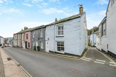 a street with a white building on the side of a road at 2 Bed in Padstow oc-p00505 in Padstow