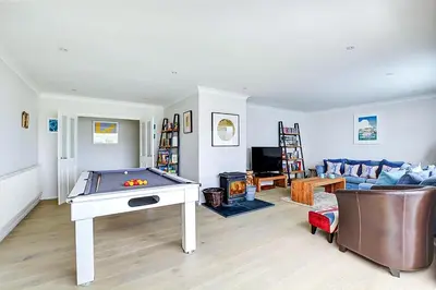 a living room with a pool table and a couch at 4 Bed in Padstow oc-p00528 in Padstow