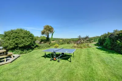 a ping pong table in the middle of a lawn at 4 Bed in Padstow oc-p00528 in Padstow