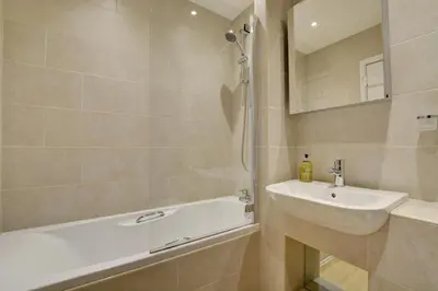 a bathroom with a sink and a bath tub and a sink at 2 Bed in Padstow oc-p00531 in Padstow