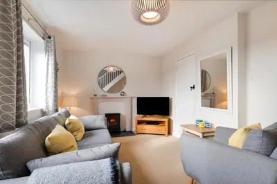 a living room with two couches and a tv at 2 Bed in Padstow oc-p00531 in Padstow