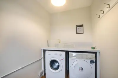 a laundry room with a washer and dryer in it at 2 Bed in Padstow oc-p00531 in Padstow