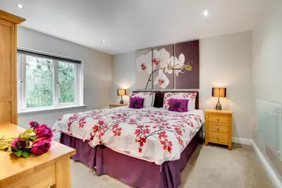 a bedroom with a large bed and a window at 3 Bed in St. Merryn oc-p00569 in St Merryn