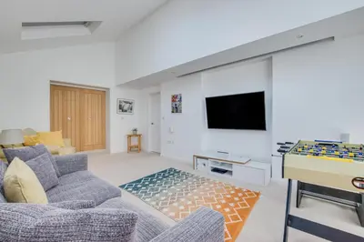 a living room with a couch and a tv at 6 Bed in Constantine Bay oc-p00571 in St Merryn