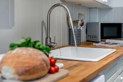 a kitchen counter with a sink and a loaf of bread at 2 Bed in Padstow oc-p00572 in Padstow
