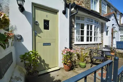 a green door on a house with potted plants at 2 Bed in Padstow oc-p00572 in Padstow