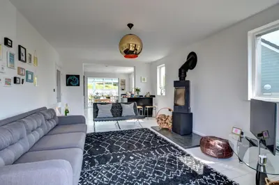 a living room with a couch and a fireplace at 4 Bed in Mawgan Porth oc-p00608 in Mawgan Porth