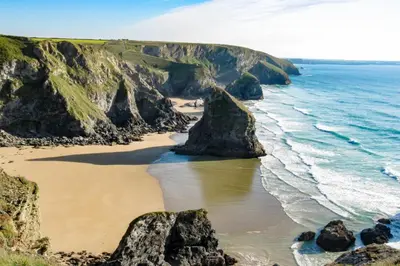 a view of a beach with rocks and the ocean at 4 Bed in Mawgan Porth oc-p00608 in Mawgan Porth