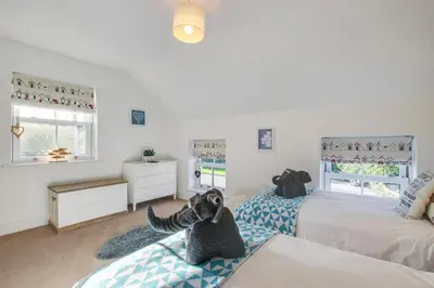 a bedroom with two beds and a dresser at 2 Bed in St. Merryn oc-p00607 in St Merryn